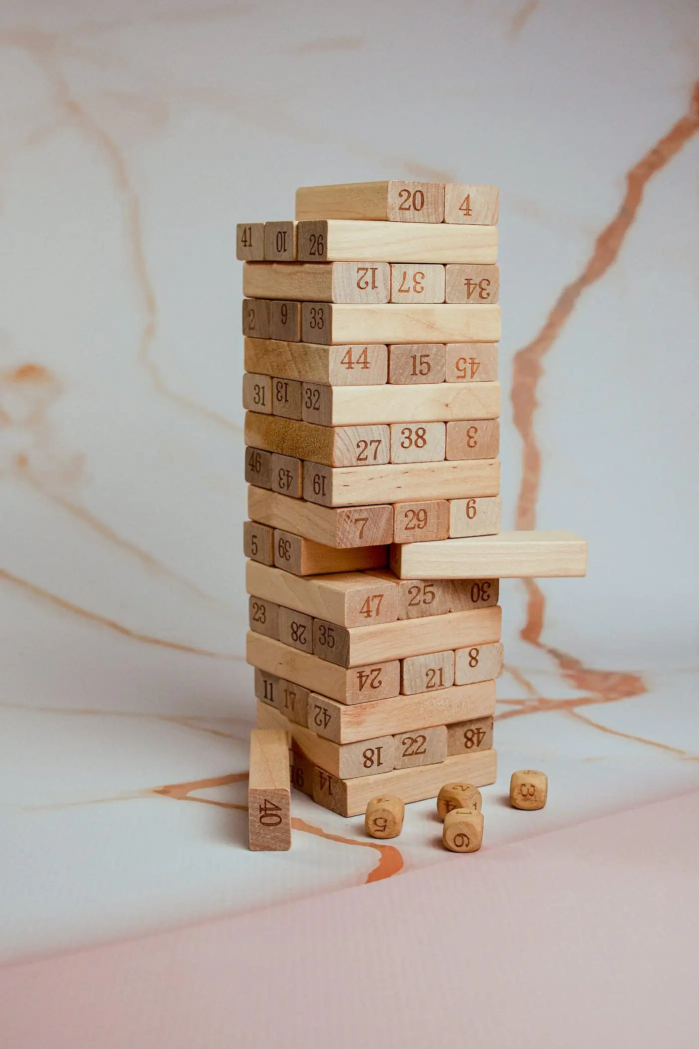 A tower of wooden blocks with numbers on them